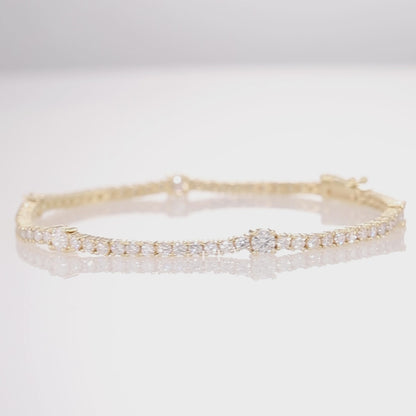 14K Solid Gold Tennis Bracelet With Smaller and larger Diamonds Design